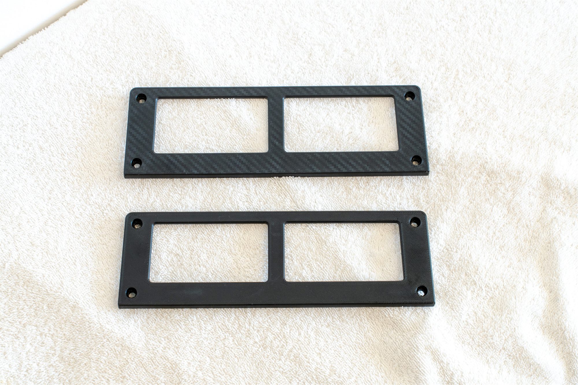 Reproduction Fiero aux gauge covers in carbon weave and smooth finish, side by side